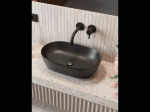 Vasque SYRNA ovale 50 cm en céramique noir mat. Lavabo design à poser avec technologies UP-SLIM et UP-CLEAN. Garantie 10 ans. Livraison gratuite.